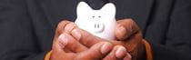 Man holding a piggy bank